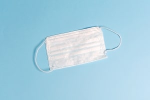 image of surgical mask with blue background